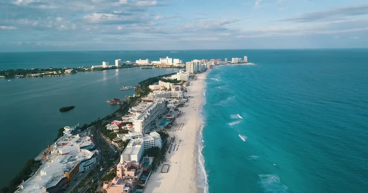 Cancún turquoise Caribbean beach with white sand and palm trees